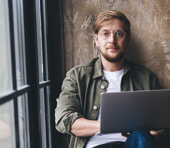 Professional team member working with laptop